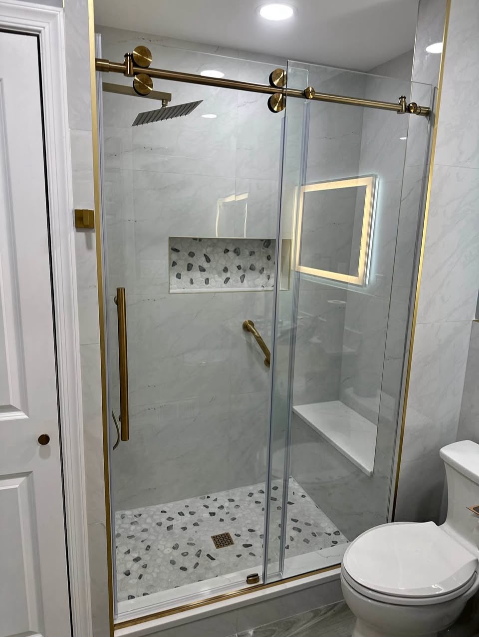 Bathroom remodel with marble tile and glass shower Morris County NJ